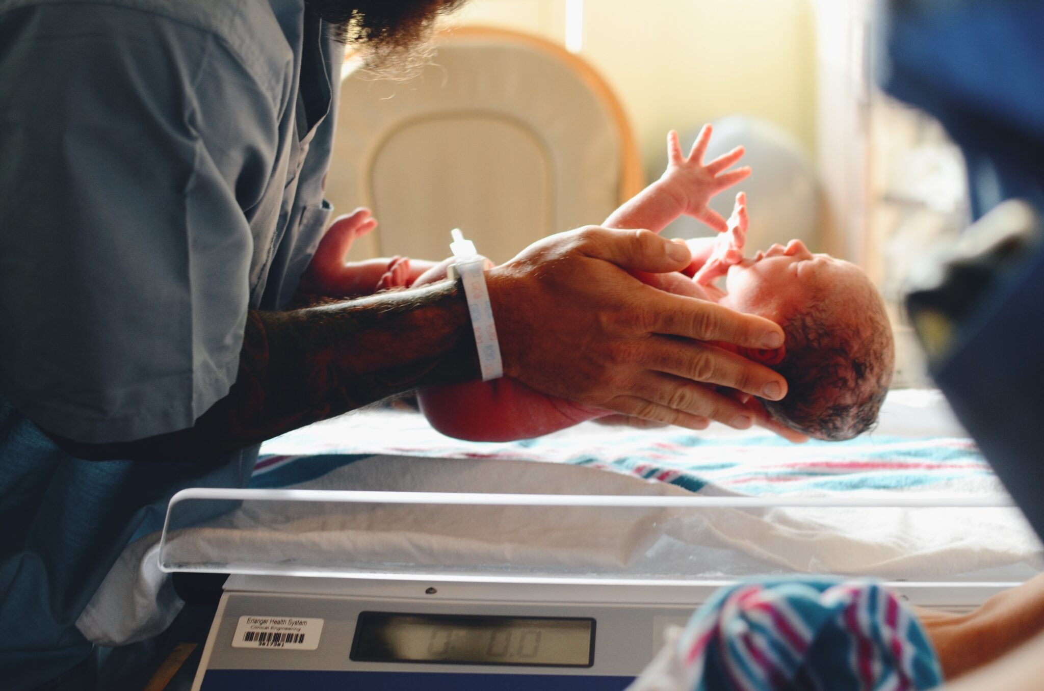 Person Holding Infant 2048X1356